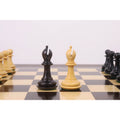 The light and dark wood Bishop pieces from the 3.9" Heritage Series Staunton chess set are positioned centrally on a chessboard.