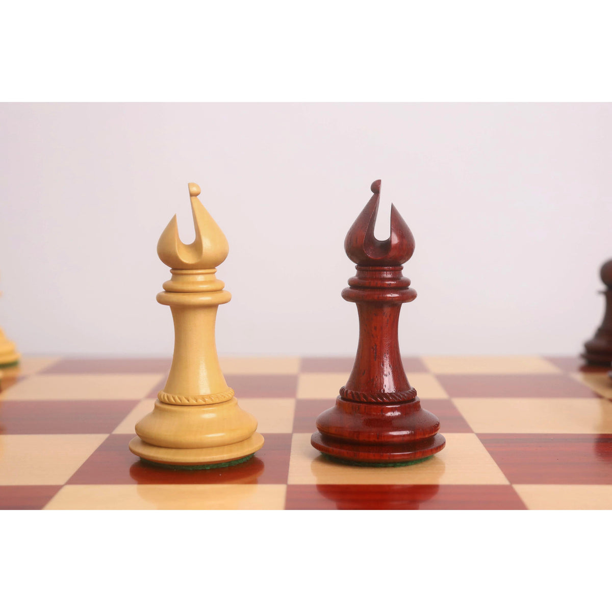 Distinctively carved boxwood and bud rosewood Bishops belonging to the 4.5" Incitatus luxury Staunton chess set.