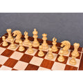 Complete set of light Boxwood Mogul Staunton chess pieces on a board.