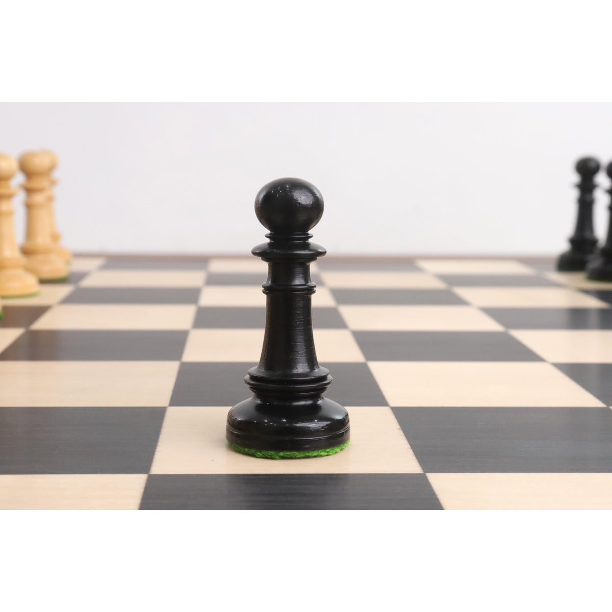 Ebony wood pawn piece from Edinburgh Northern Upright pre-Staunton chess set.