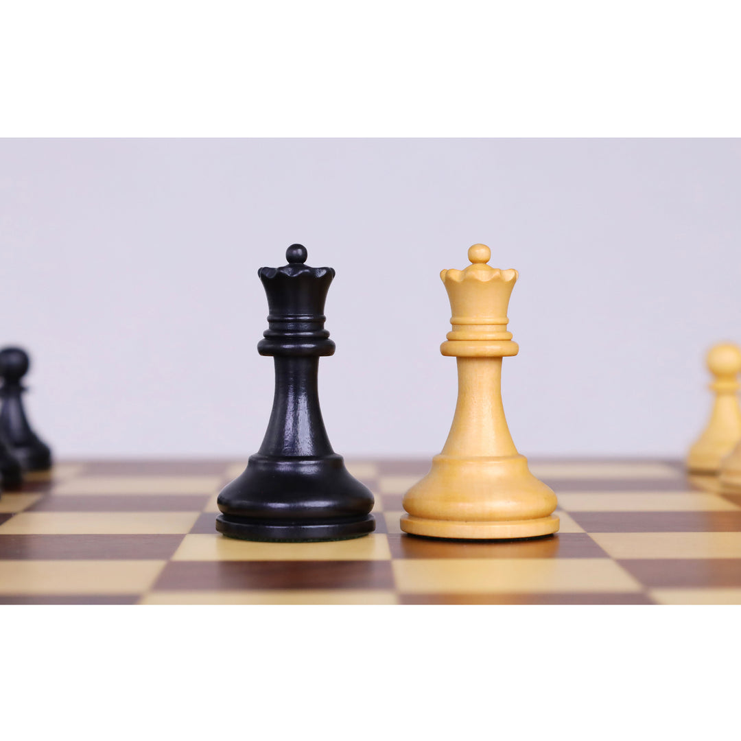 Ebonised boxwood and boxwood queen chess pieces showcased on a 12-inch magnetic travel chess set.