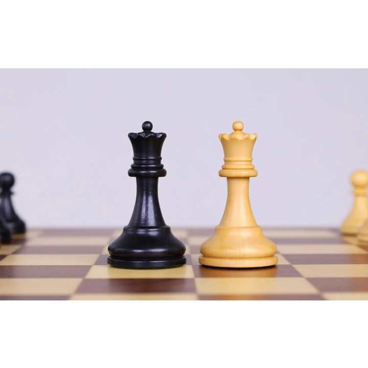 Ebonised boxwood and boxwood queen chess pieces showcased on a 12-inch magnetic travel chess set.