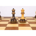 A side-by-side view of a dark and a light golden rosewood Staunton queen on a 20-inch legacy chess board.