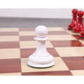 White pawn chess piece positioned neatly on a wooden square.