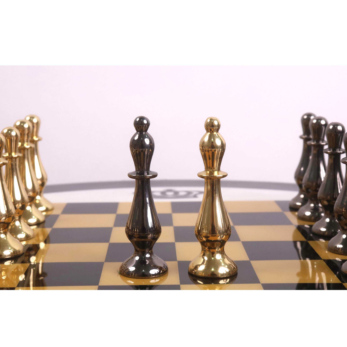 Metallic grey and gold brass bishops of the Regal Curve Series chess set.