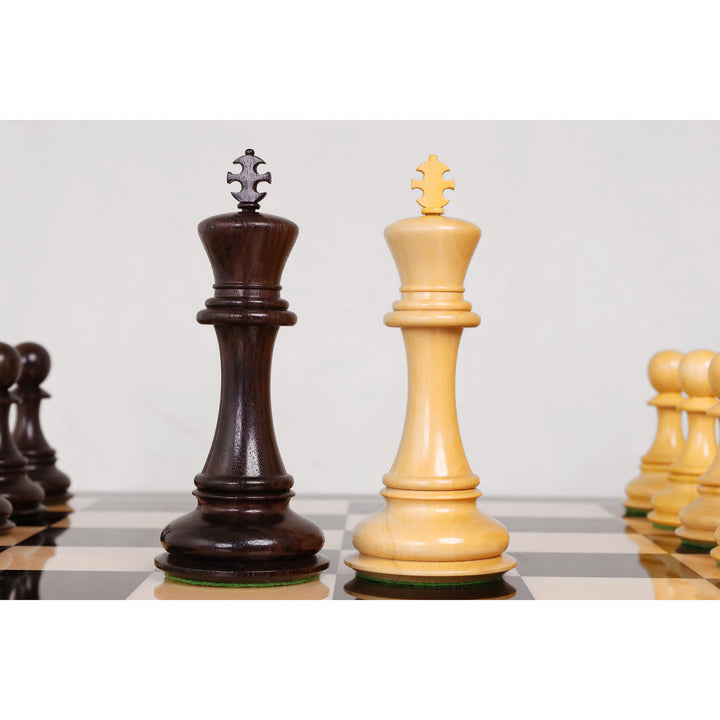 Macro view of hand-carved dark and golden rosewood king chess pieces.