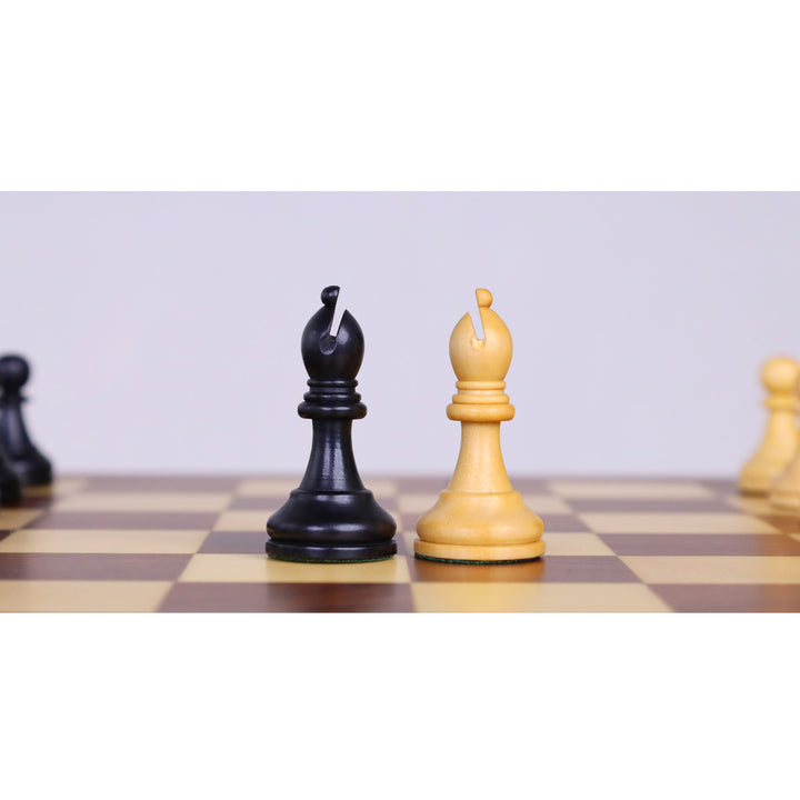 Ebonised boxwood and boxwood bishop chess pieces standing on a magnetic wooden chess board.