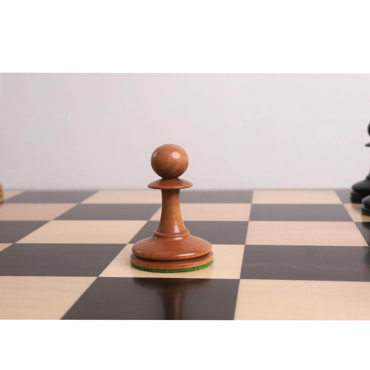 Comparison of Ebony and Antiqued Boxwood pieces, emphasizing the vintage patina and wood grain.