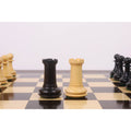 The light and dark wood Rook pieces from the 3.9" Heritage Series Staunton chess set are positioned centrally on a chessboard.