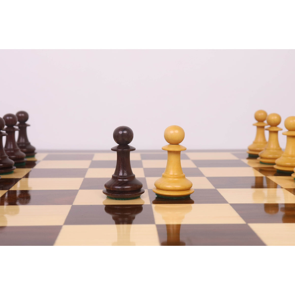 Close up of Rosewood and Boxwood Pawn pieces from the 3.9" Heritage Series Staunton Chess Set.