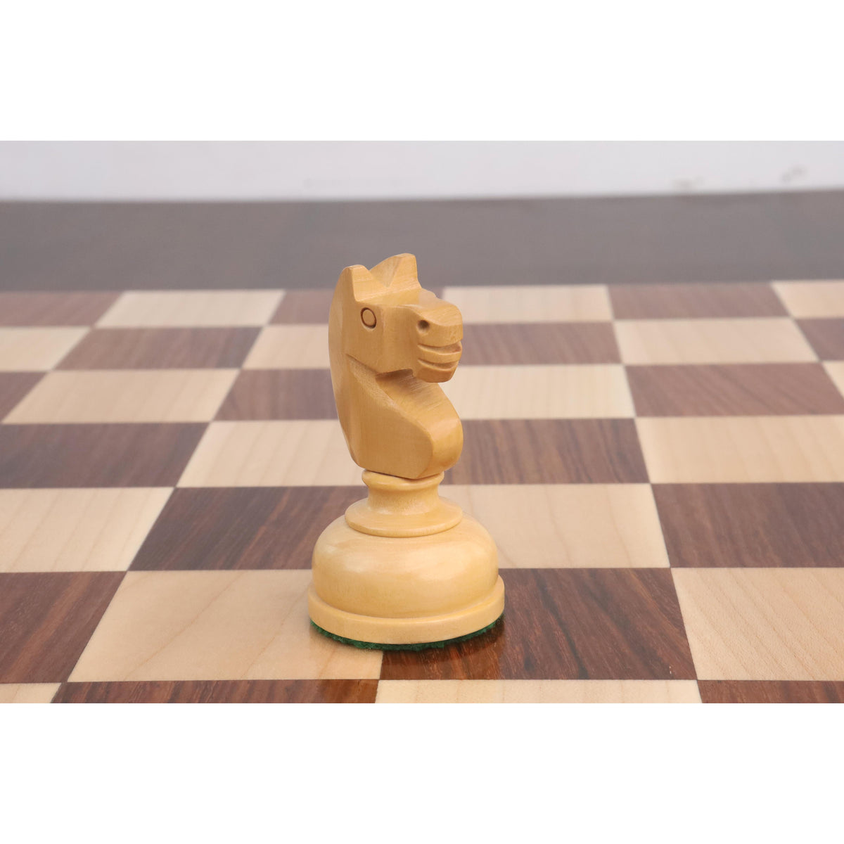 Polished Boxwood Knight chess piece from the Library Series showcasing intricate hand-carvings.