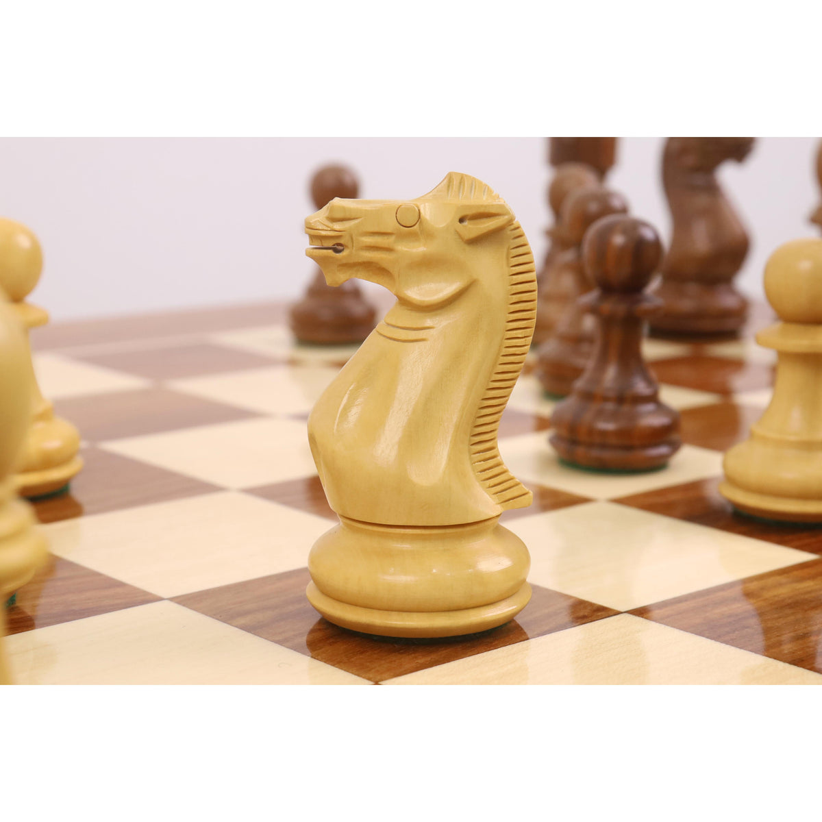 High-angle view of the 23" tournament chess board surface with Pro Staunton pieces in a starting position.