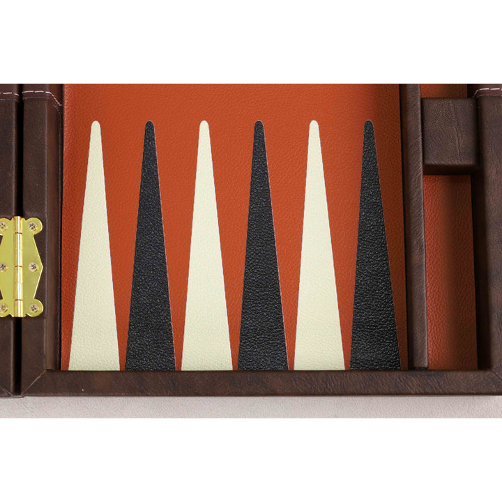 Close-up of black and ivory playing points on the terracotta board
