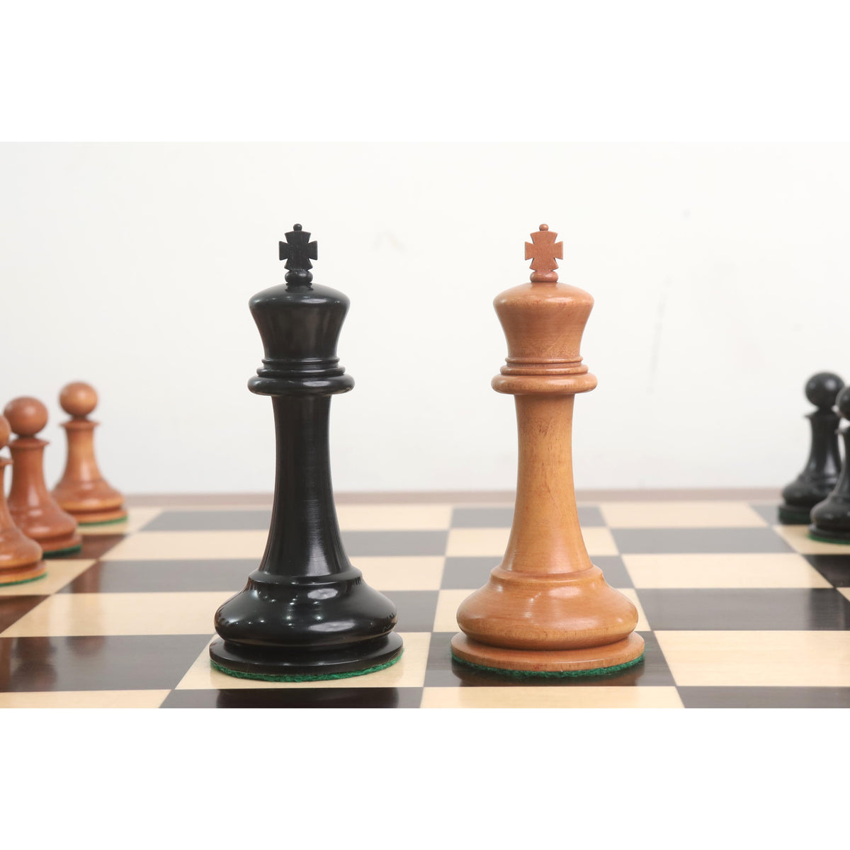 Pair of 4.3 inch kings in ebony and antiqued boxwood from the 1849 Cooke Staunton collection.