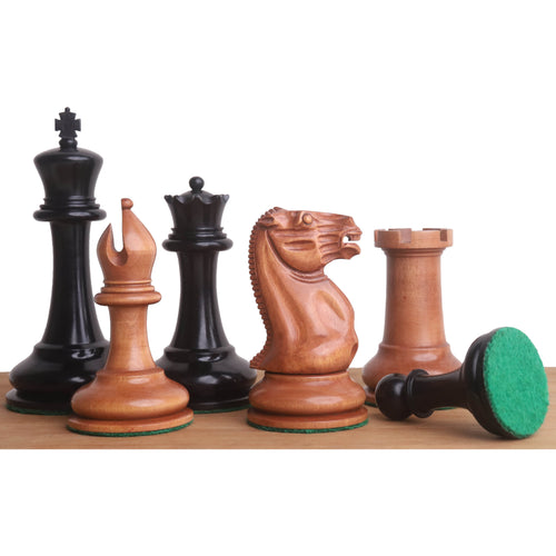 Ebony and antiqued boxwood 1849 Cooke Staunton chess pieces with green felted bases.
