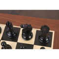 Top view of ebony bishop, knight, and rook showing red crown markings for king-side identification.