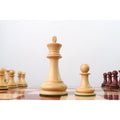 Boxwood King and Pawn from the 1849 Jacques Cook Staunton series viewed from a low perspective.