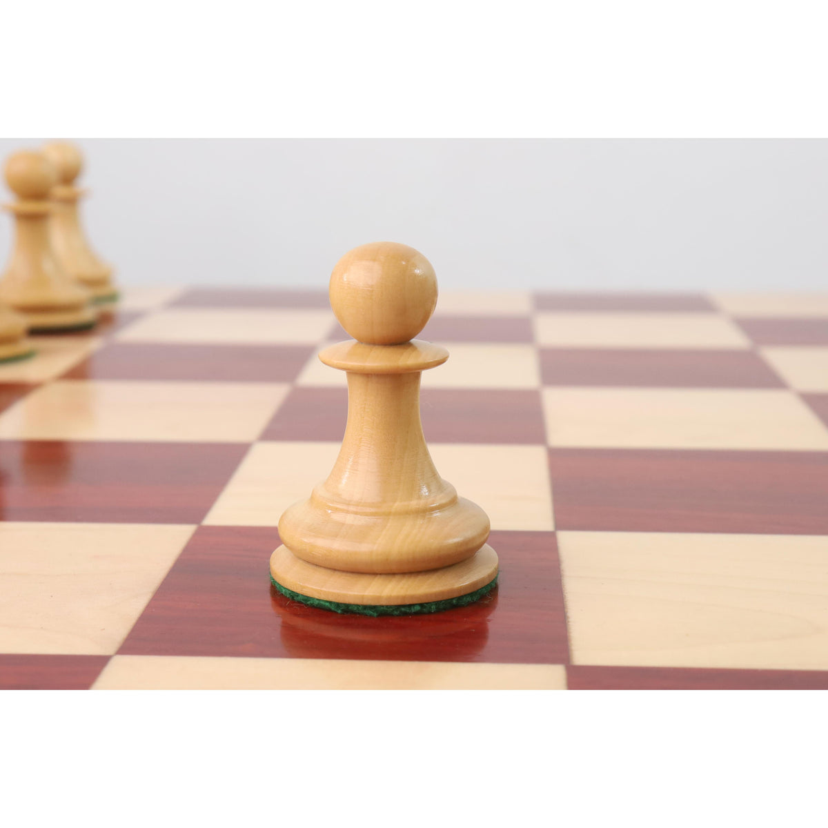 Single weighted Boxwood Pawn from the 1849 Jacques Cook Staunton collectors chess set.