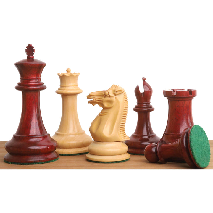 1849 Jacques Cook Staunton chess pieces in Bud Rosewood and Boxwood on a wooden surface.