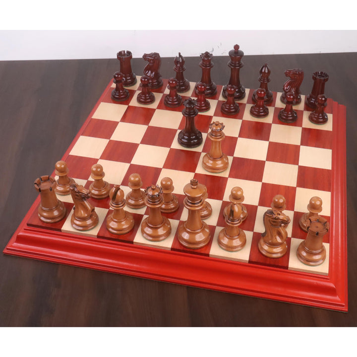 Full 1849 Staunton chess set in antiqued boxwood and bud rosewood displayed on a matching board.