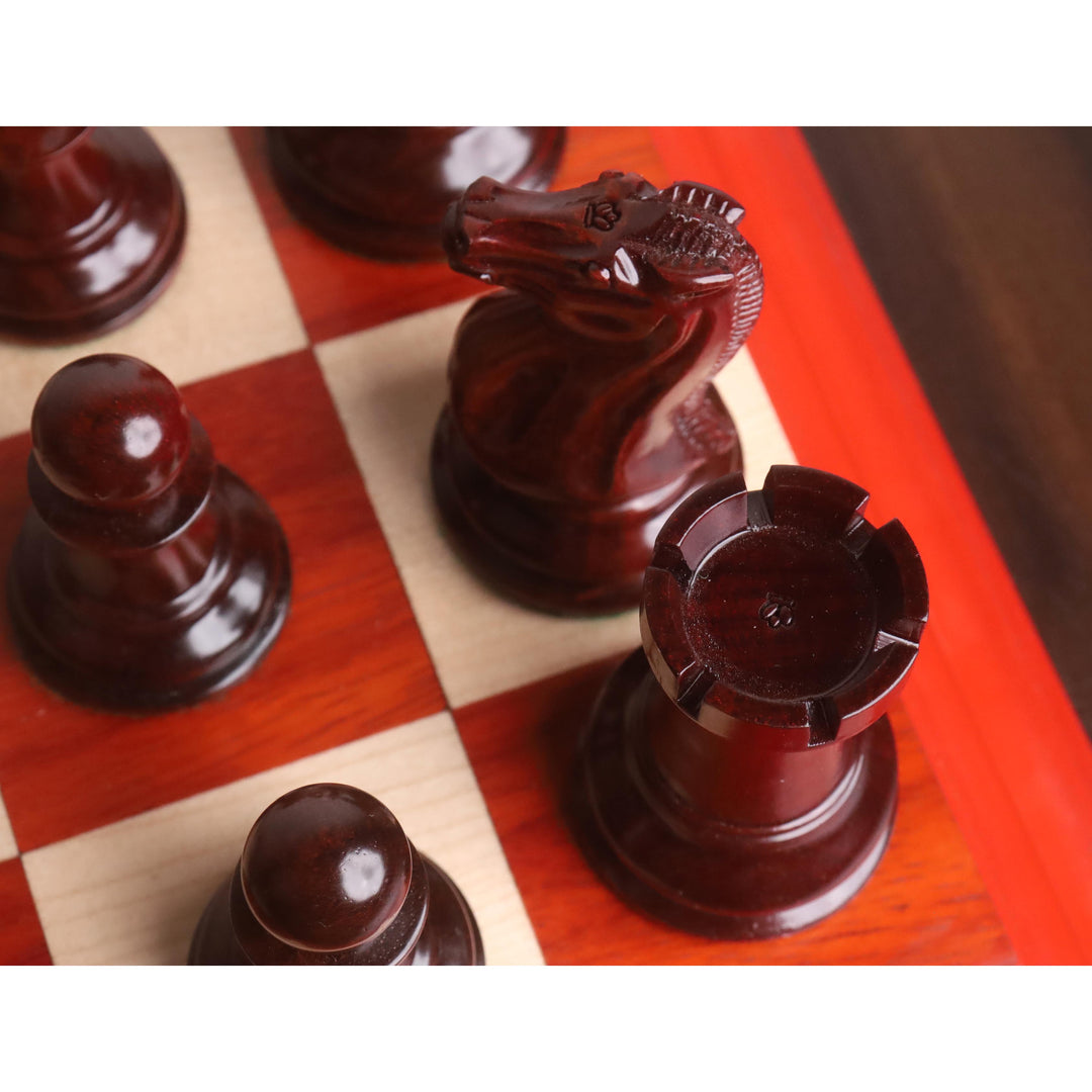 Detailed top-down shot of the 1849 Staunton bud rosewood knight and rook pieces on a board.