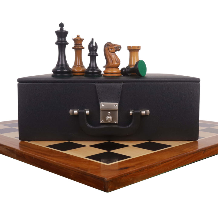 1849 Staunton chess pieces in antiqued boxwood and ebony displayed on a black leatherette storage box.