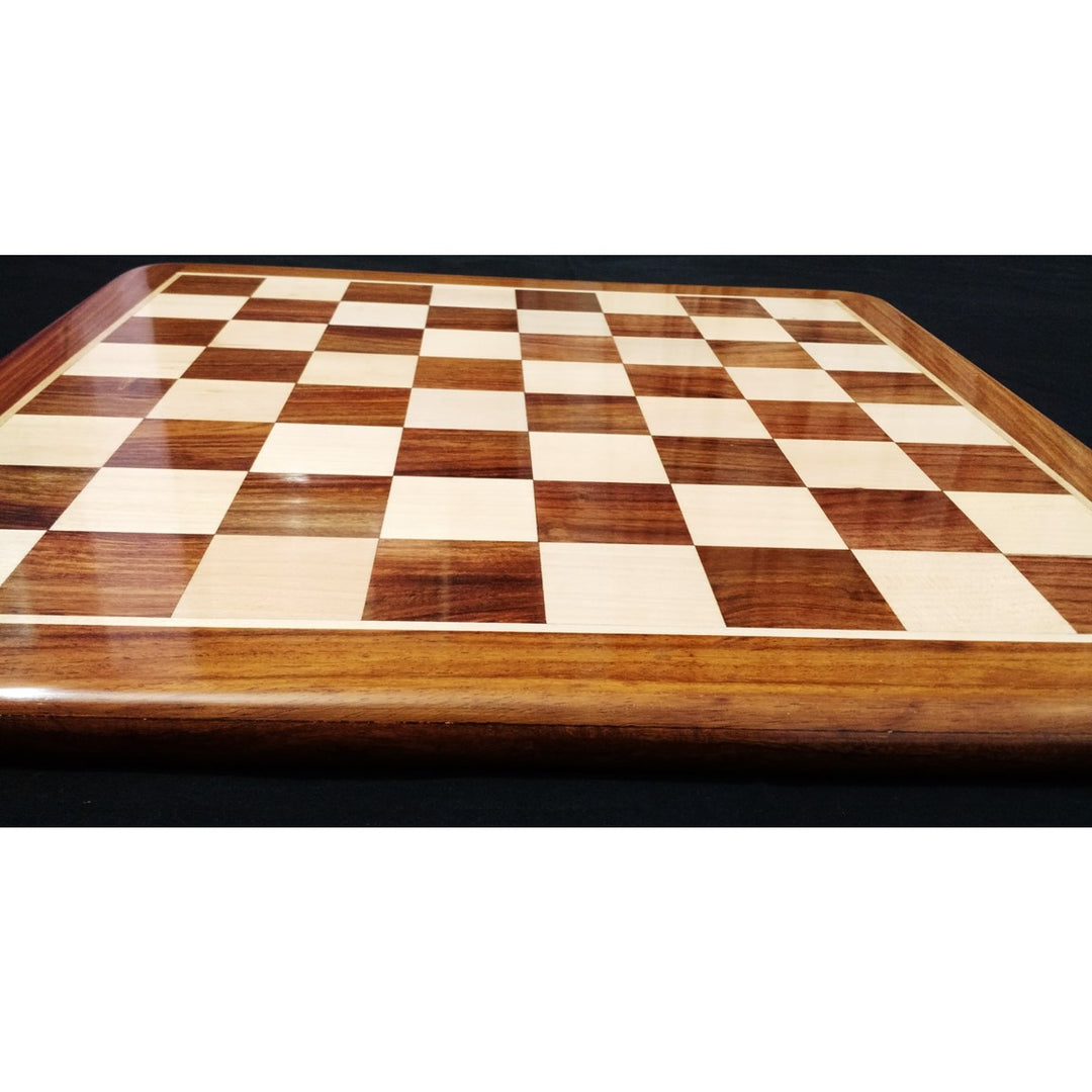 Side view of a 19 inch golden rosewood and maple wood chess board showing its slim, solid profile.