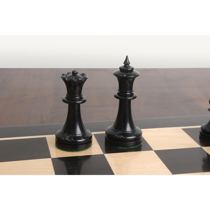 Ebony King and Queen from the 1900s' American Chess Company reproduction set on a board.