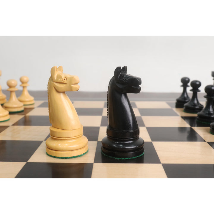 Angled view of ebony and boxwood knights from the 1900s American Chess Company reproduction.