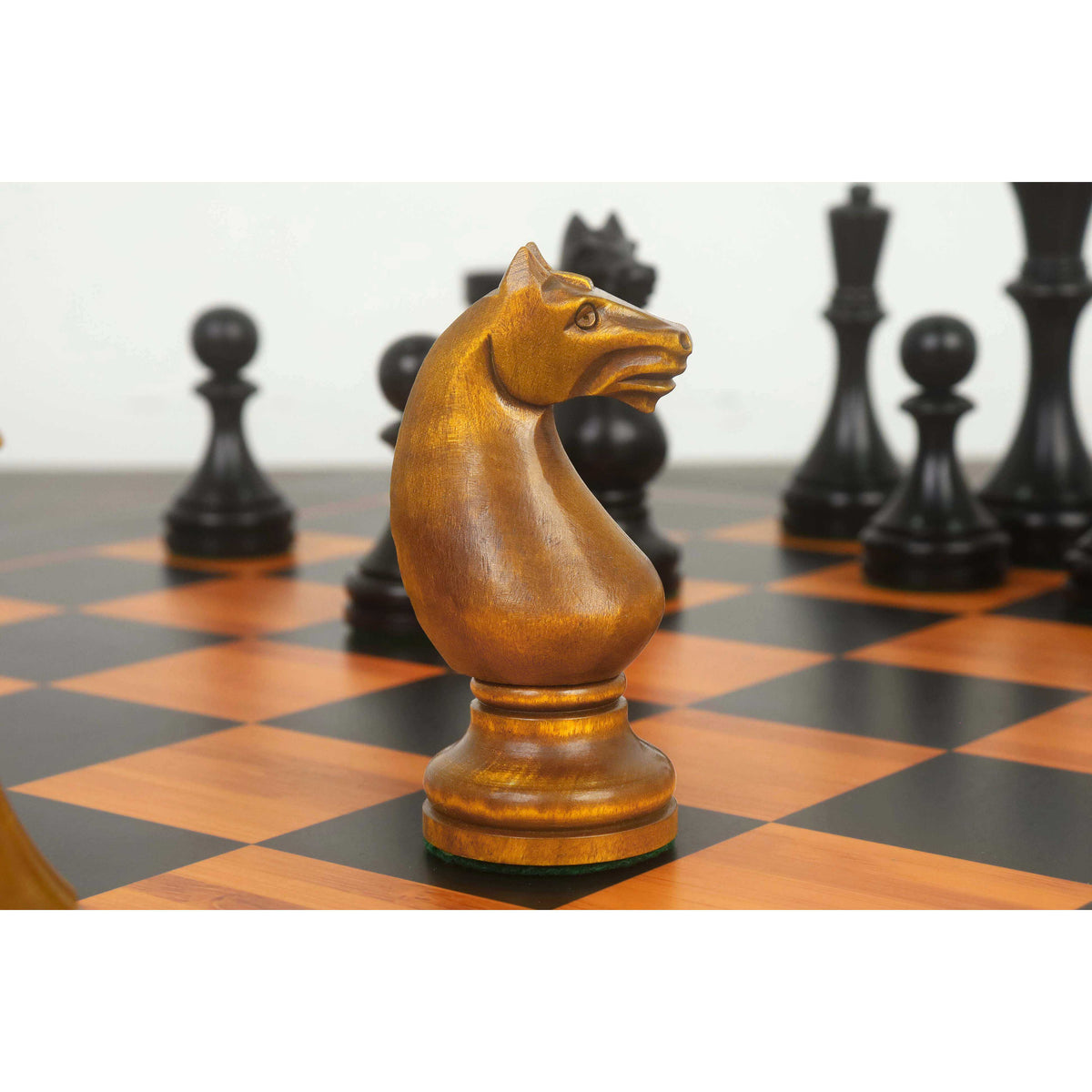 Close-up of a 1935 Botvinnik Flohr-II Soviet knight in distressed antiqued boxwood.