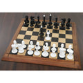 Full 1940s Soviet reproduction chess set with black and white lacquer pieces on a professional board.
