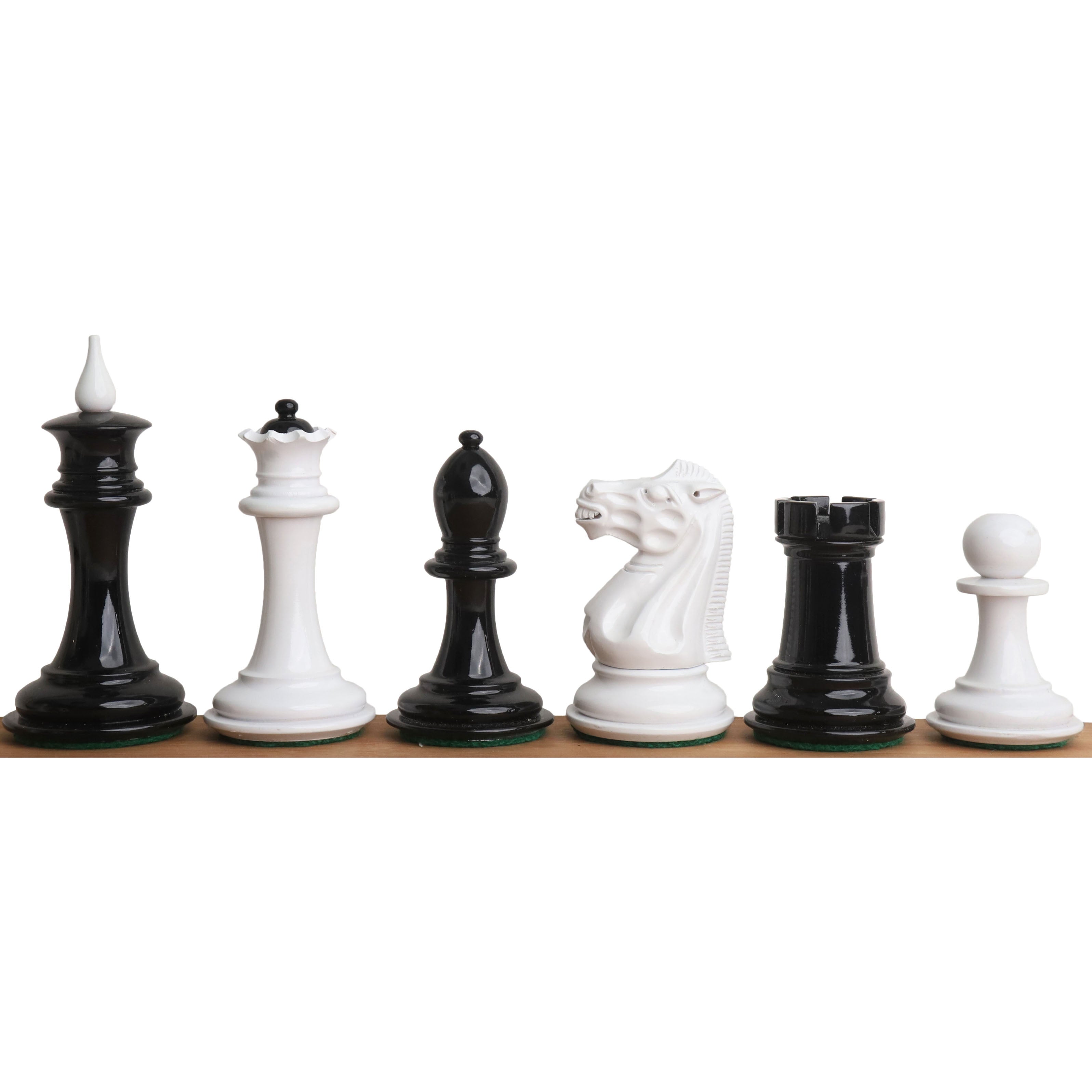 A complete lineup of black and white lacquer Soviet reproduction chess pieces on a wooden base.