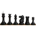 Full side profile of black lacquer boxwood chess pieces with contrasting white finials from the Soviet set.