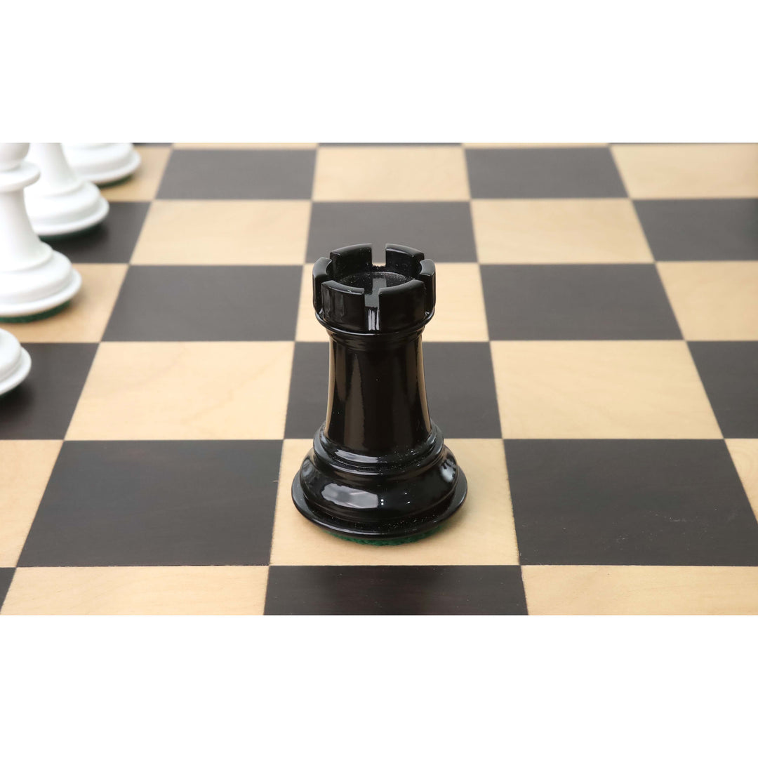 A single black lacquer rook from the 1940s Soviet reproduction set centered on a chessboard.