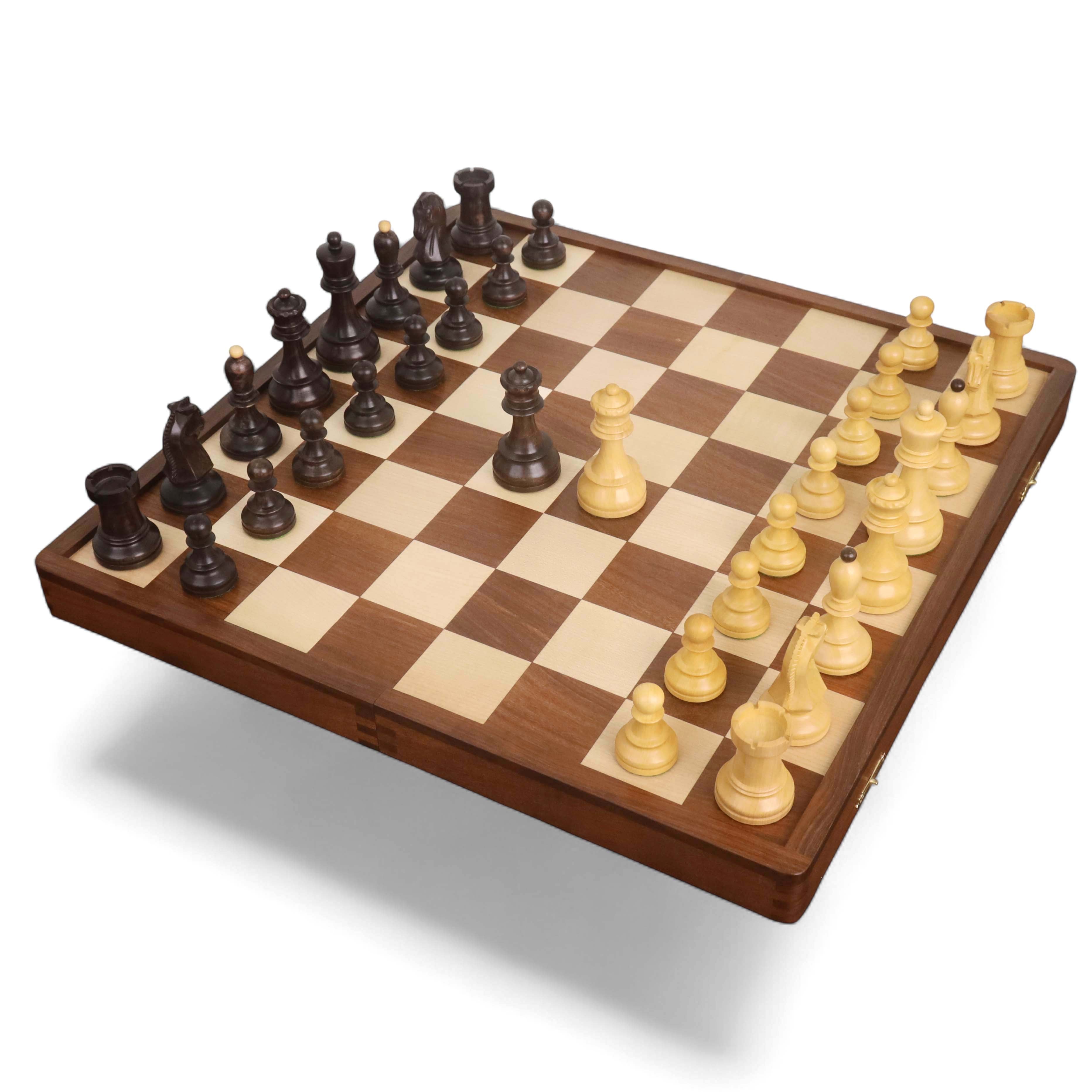 Full 1950s Fischer Dubrovnik chess set with ebonized and boxwood pieces on a folding wooden board.