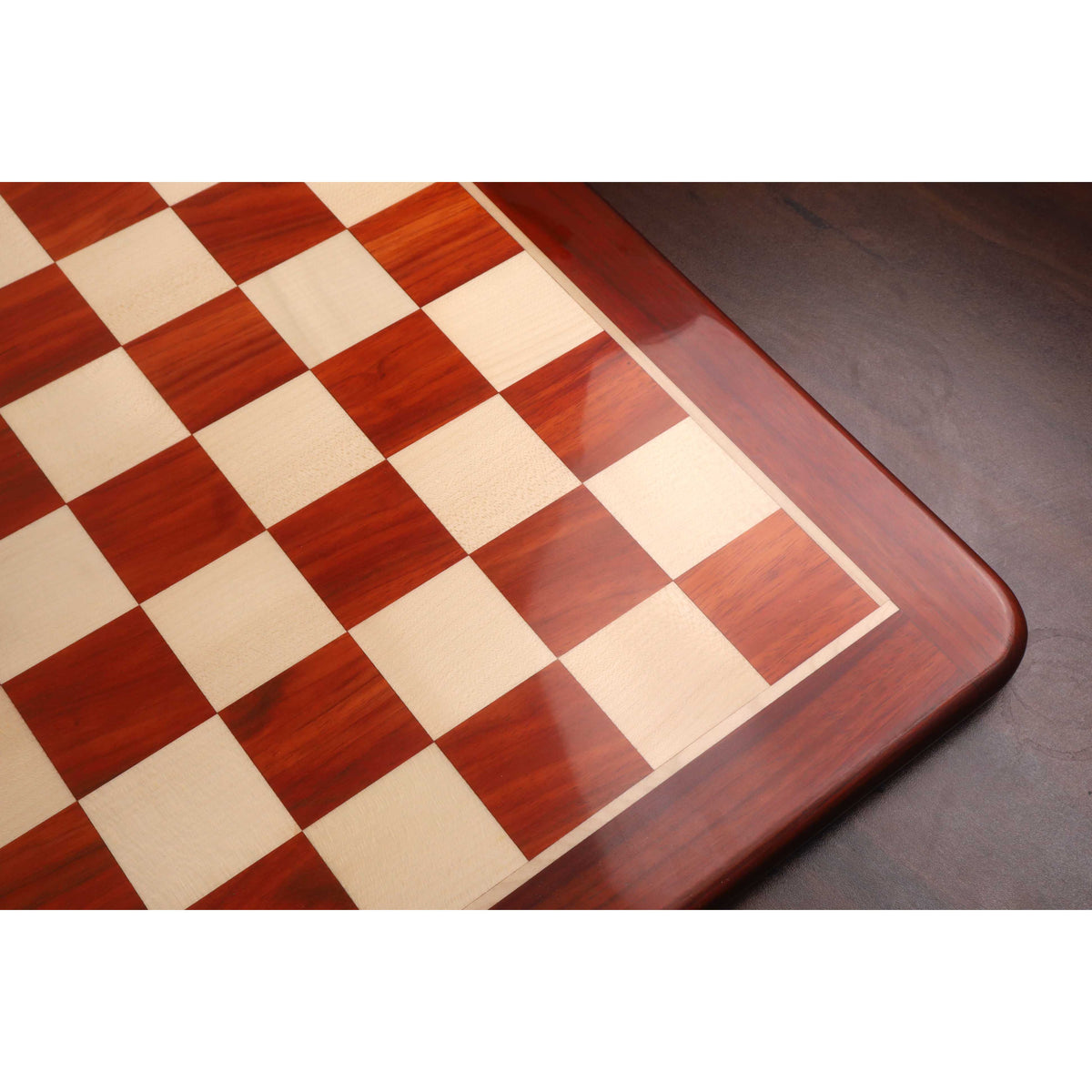 High-angle shot of the glossy finish and vibrant red hues of the Bud Rosewood squares.