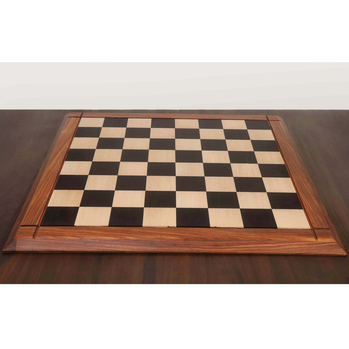 25 inch Players Choice ebony and maple wood chess board with 65 mm squares and matte finish.