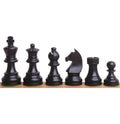 Ebonised boxwood Staunton chess pieces displayed in a complete black army lineup.