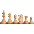 Natural boxwood chess pieces from the 1972 Fischer Spassky championship set displayed in a row.
