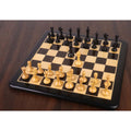 Full setup of the 3.5-inch Monolith miniature chess pieces in ebonised wood and boxwood on a glossy chessboard.