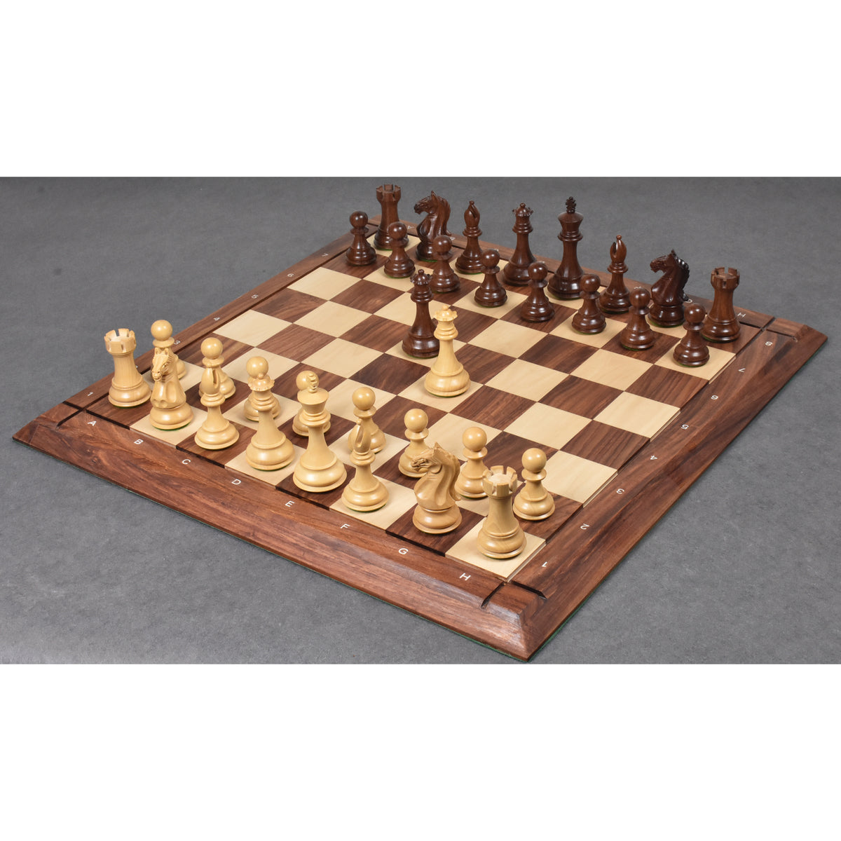 Full 4 inch Fierce Knight Staunton chess pieces set arranged on a premium wooden chessboard.