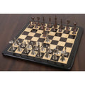 Full set of luxury metal chess pieces on a premium wooden chess board.