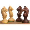 Close up of golden rosewood and boxwood Averbakh Soviet knight chess pieces.