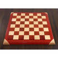 Overhead view of a 21 inch bud rosewood and maple wood luxury chessboard with 55 mm squares.