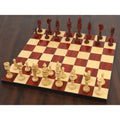4.7" Lotus Series weighted Bud Rosewood chess set displayed on a wooden board.