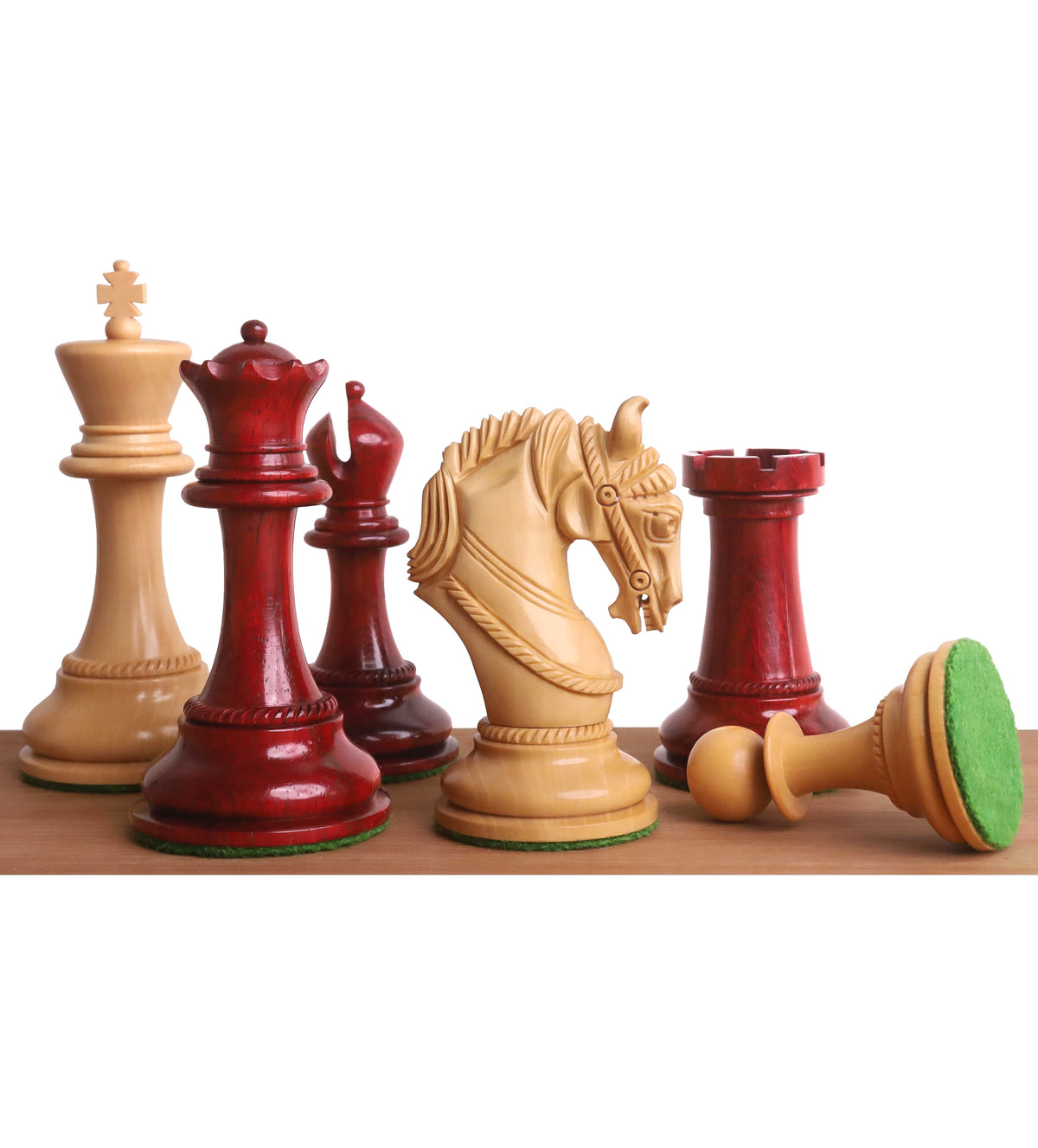 Close-up of hand-carved bud rosewood and boxwood Imperator chess pieces.