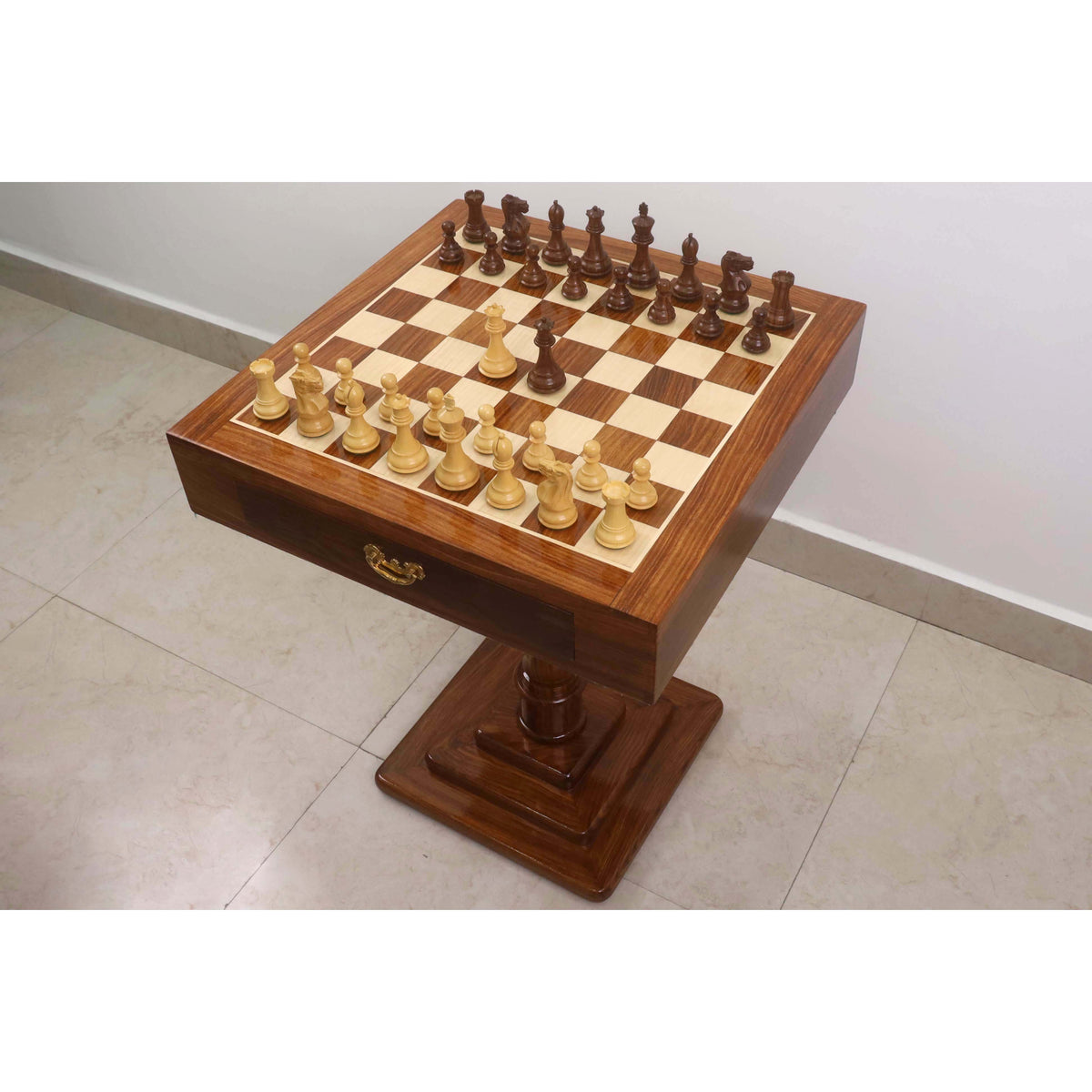 Golden rosewood Staunton pieces on a 20 inch Monarch series wooden chess table.