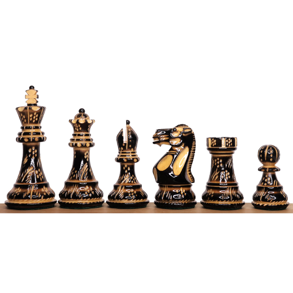 A complete set of 4" professional Staunton chess pieces in ebonized boxwood.