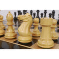 Detailed view of Boxwood Pro Staunton Knight and Rook on a wooden chessboard.