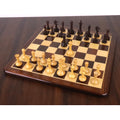 Complete 3.5" Monolith miniature chess set in rosewood and boxwood set up on a wooden chessboard.